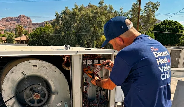 Maricopa Air technician servicing a commercial rooftop HVAC unit
